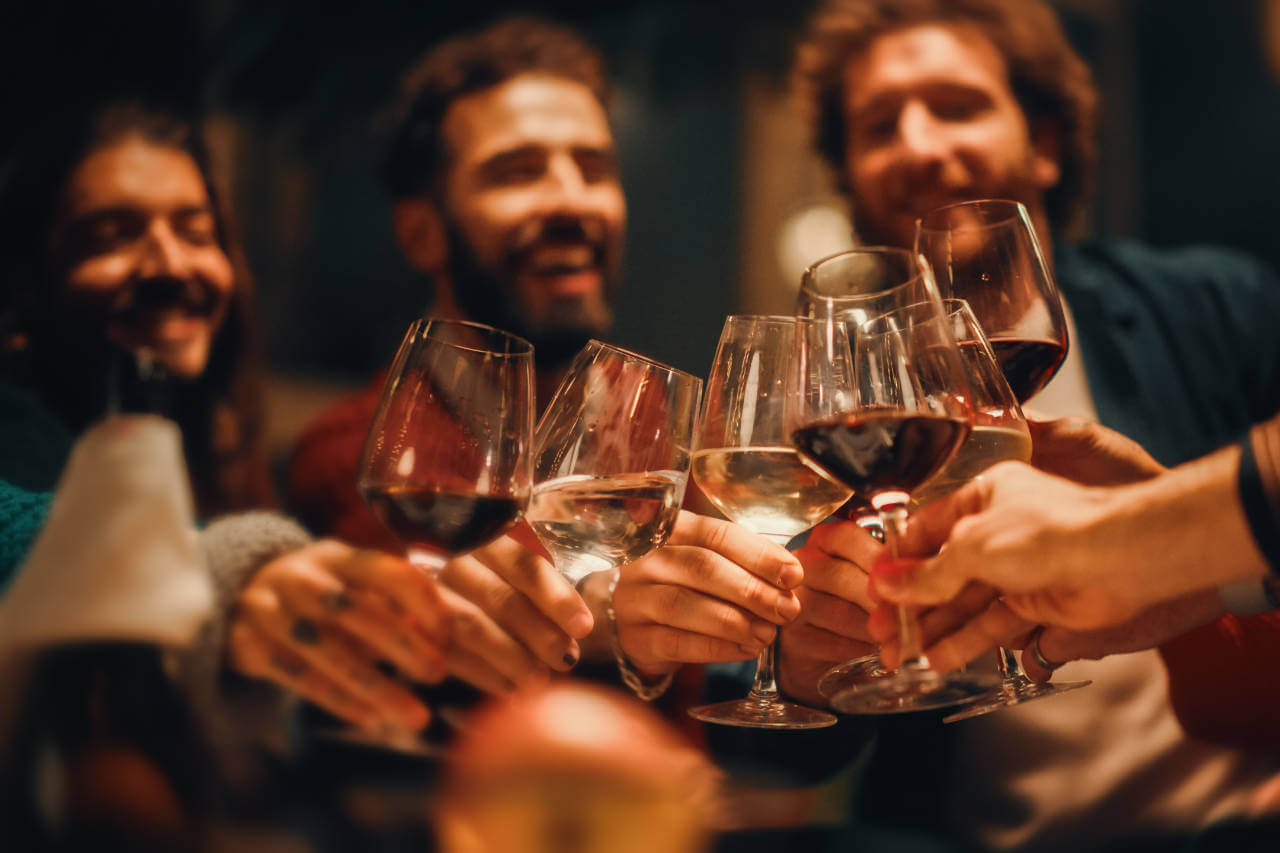 Wine Colour - People holding glasses with different wine colours in - main image